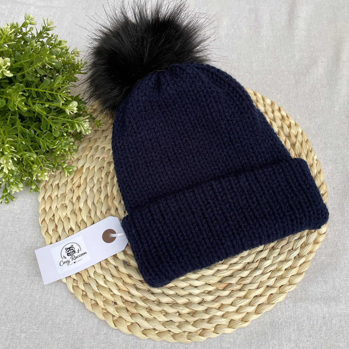 Knitted Beanie with a fluffy pom-pom