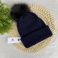 Knitted Beanie with a fluffy pom-pom