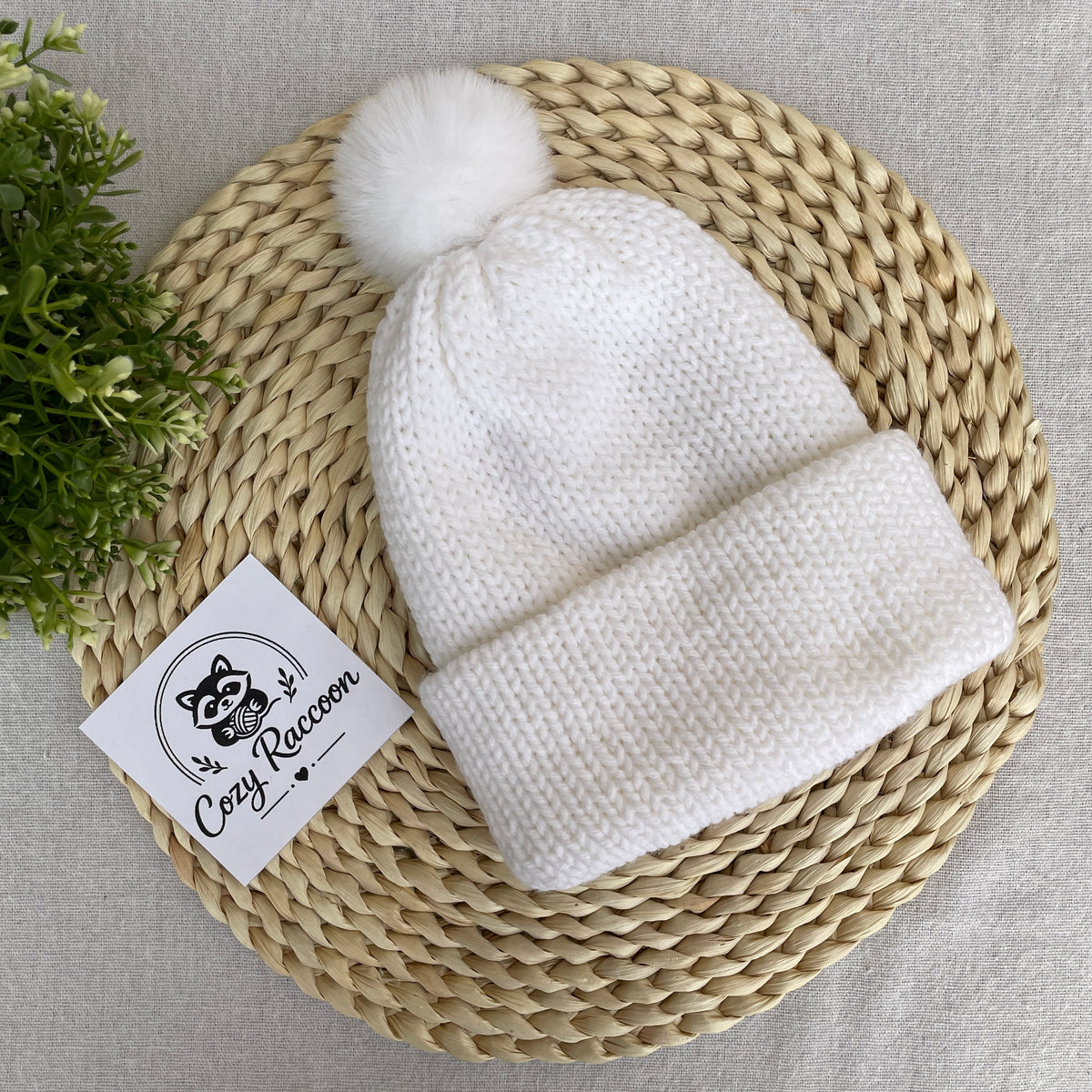 Knitted Beanie with a fluffy pom-pom