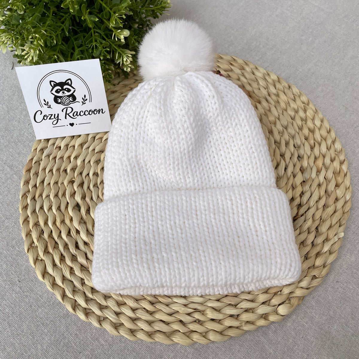 Knitted Beanie with a fluffy pom-pom